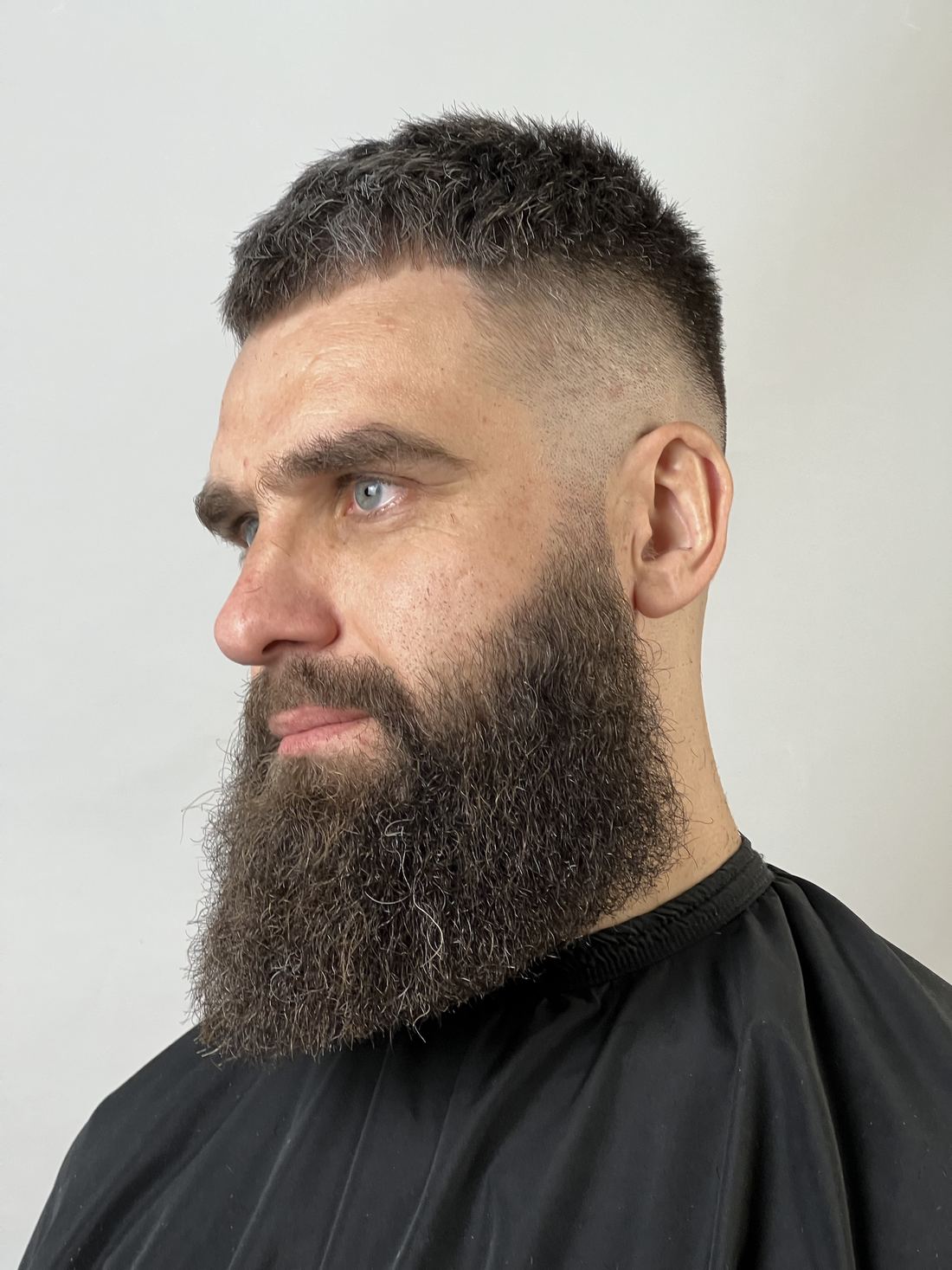 A full beard shaped and lined up with a tight skin fade at Evoke Barbers, Nottingham
