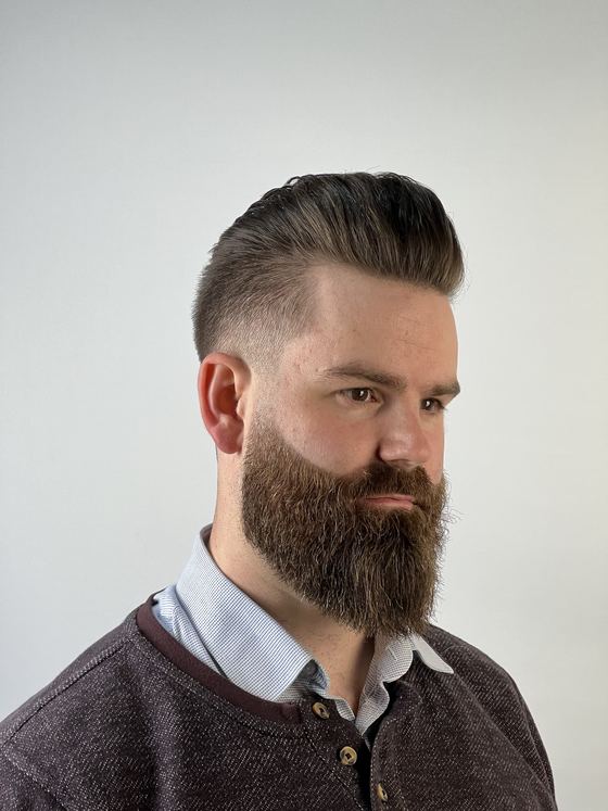 A pompadour with a taper and full beard at Evoke Barbers, Nottingham