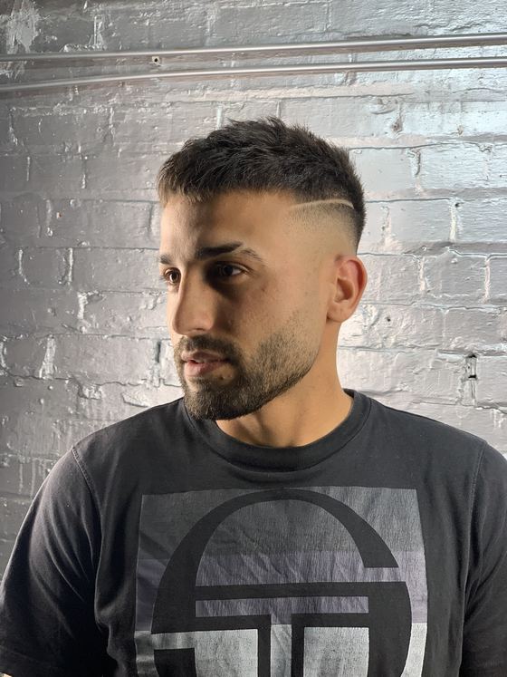 Skin fade with a carved parting at Evoke Barbers, Nottingham