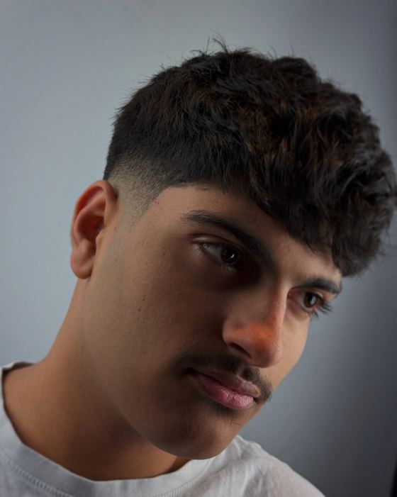 Curly textured hair cut with a fade at Evoke Barbers, Nottingham